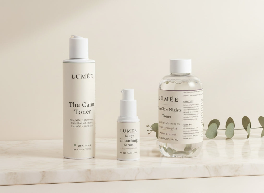 The Fresh Face Ritual — the three bottles together: Step 1 The Calm Toner, Step 2 The Eye Smoothing Serum, Step 3 The Glow Nights Toner, on warm marble in morning light